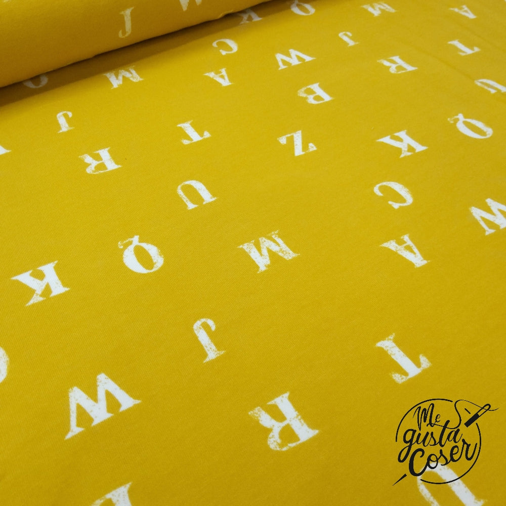 Tela Soft French terry mostaza con letras