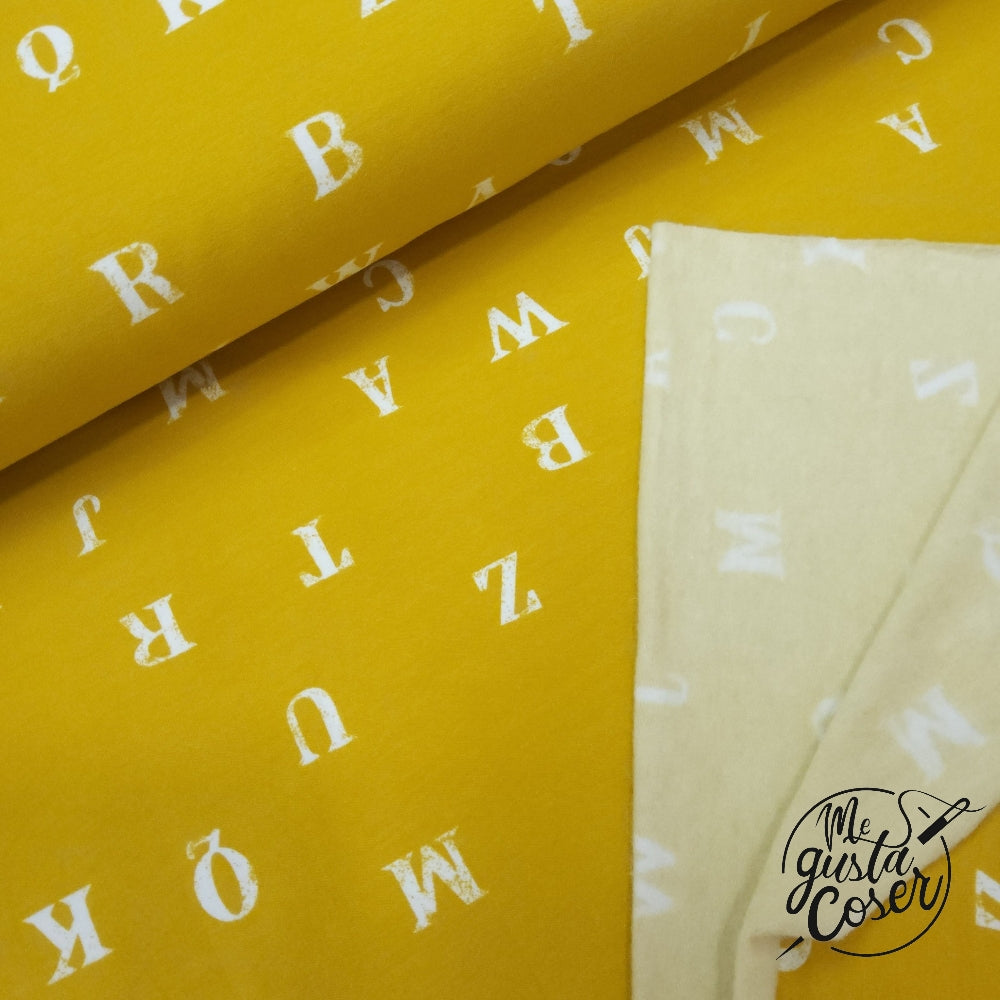 Tela Soft French terry mostaza con letras