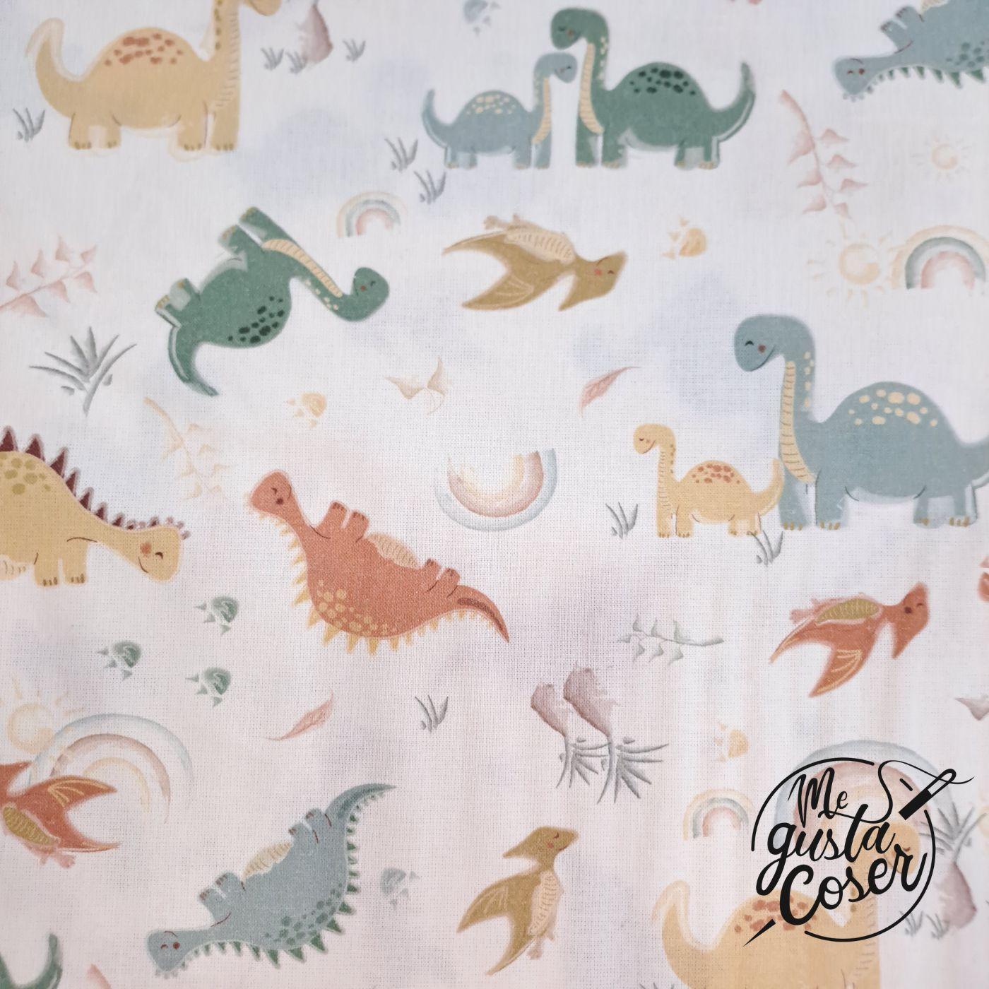 Popelín de algodón con dinosaurios en tonos pastel